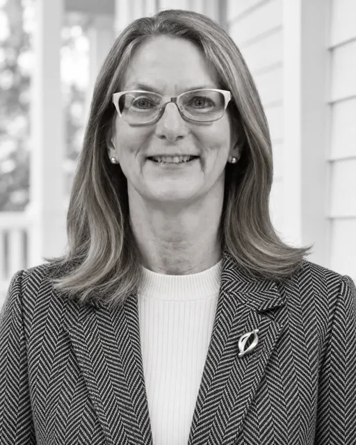 A professional headshot of Anna Haranas, a quality assurance consultant smiling at the camera.
